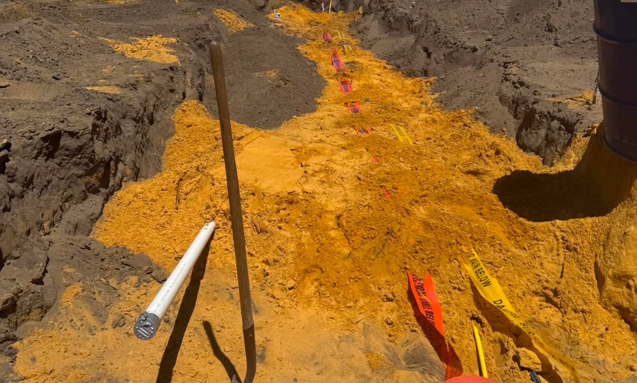 HV and LV cable corridor with electric cable warning markers in trench